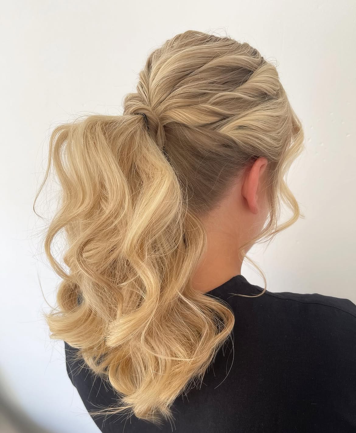 Twisted Half-Up Ponytail With Loose Curls