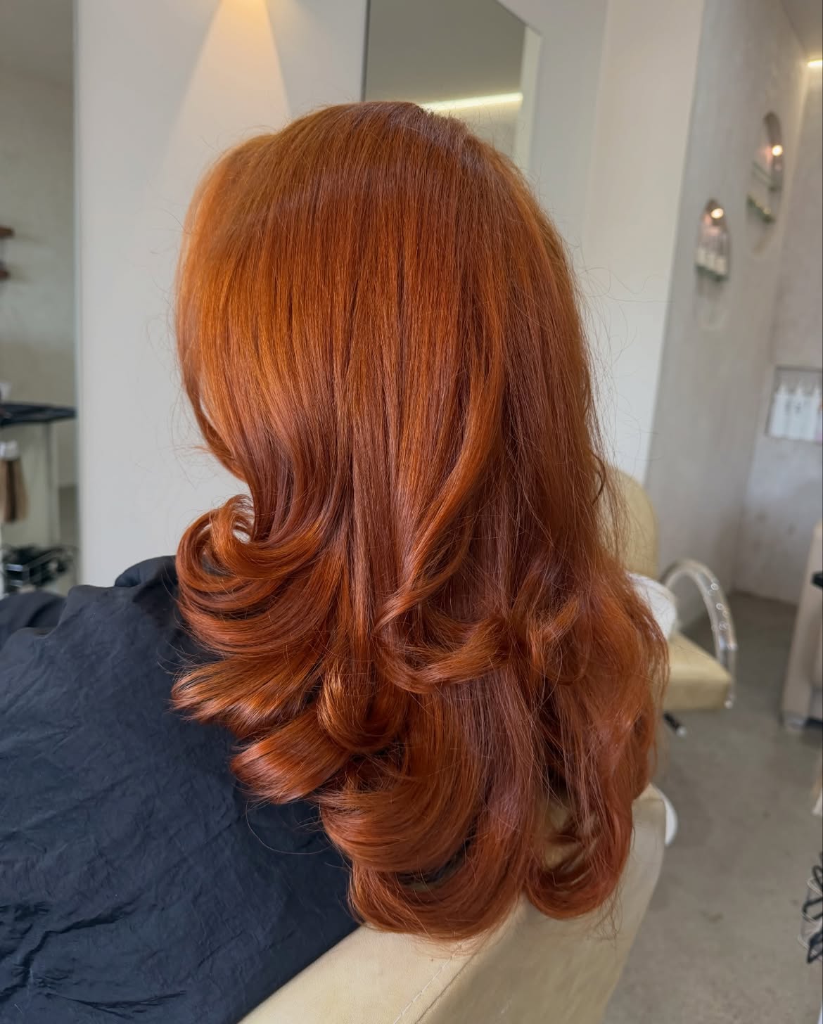 Vibrant Copper Layers With Soft Blowout Curls