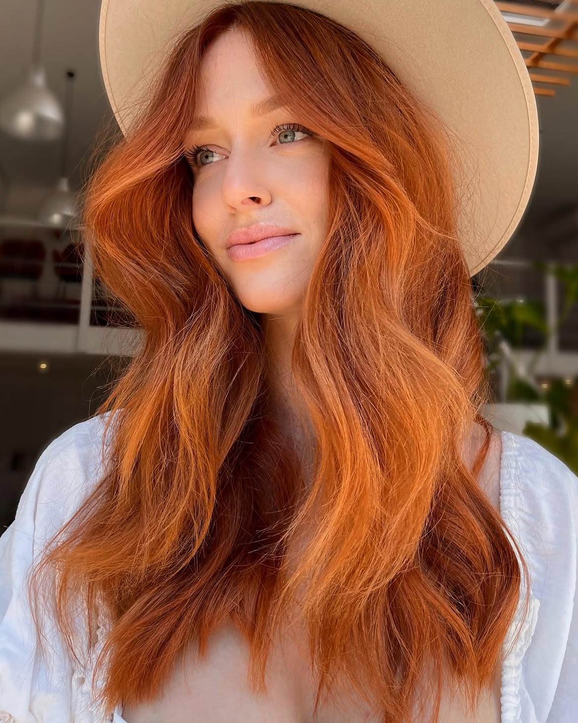 Vibrant Copper Waves With Face Framing Layers
