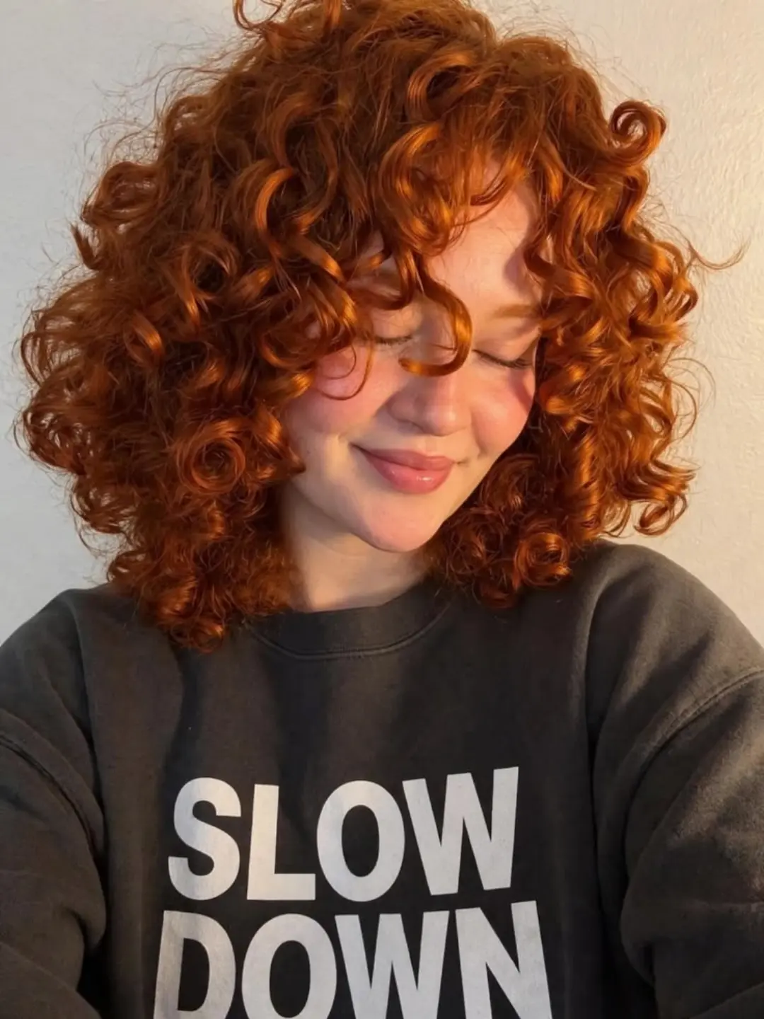 Voluminous Copper Curly Cut With Defined Ringlets