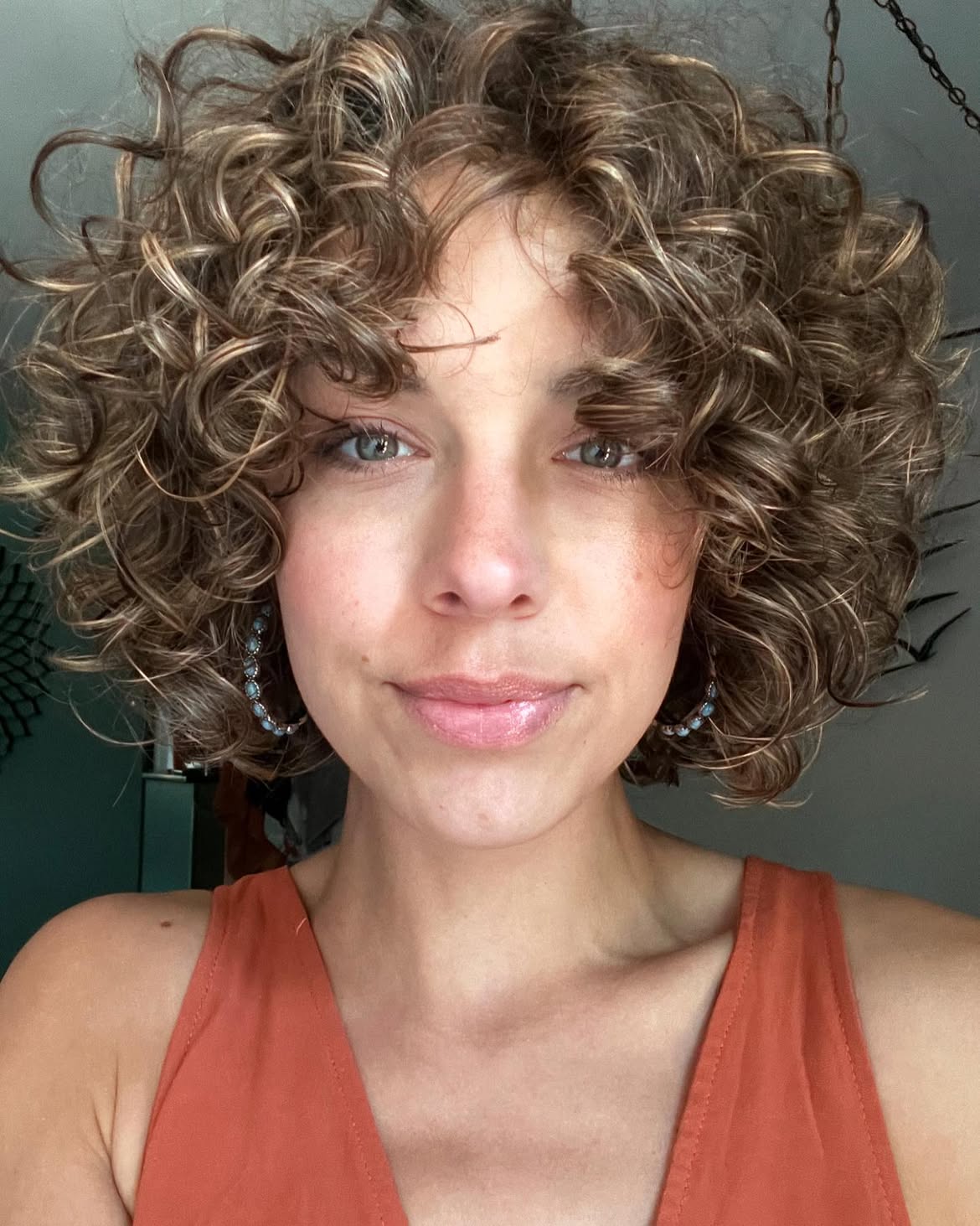 Voluminous Curly Bob With Warm Caramel Highlights