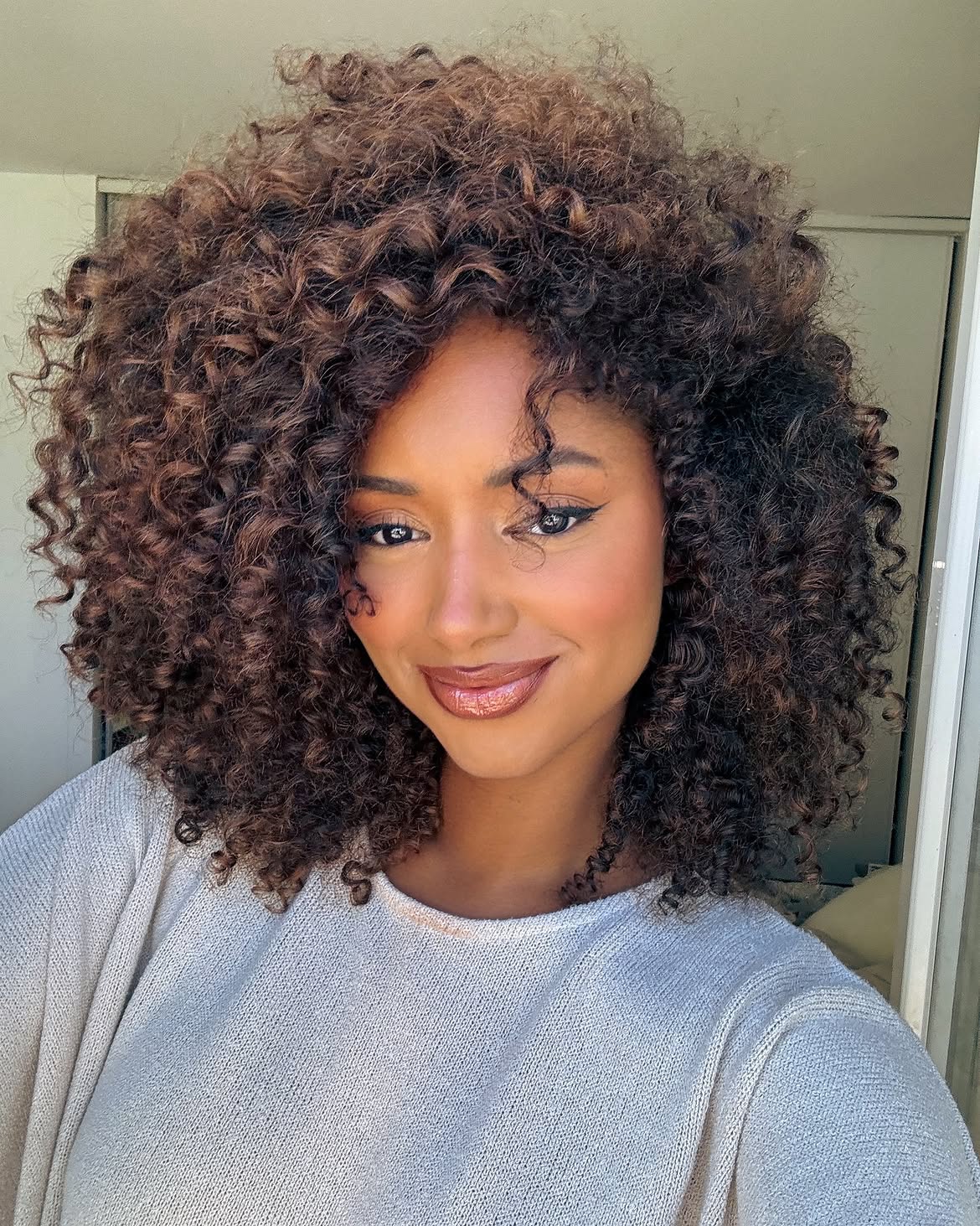 Voluminous Curly Espresso Brown Shoulder Length Cut