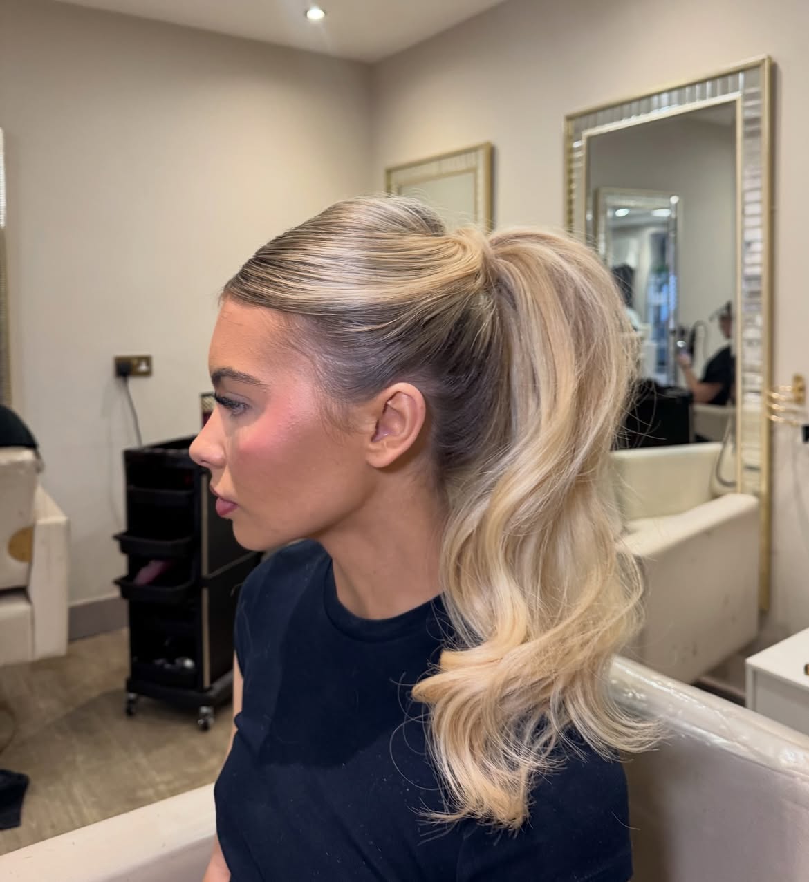 Voluminous High Ponytail With Loose Waves