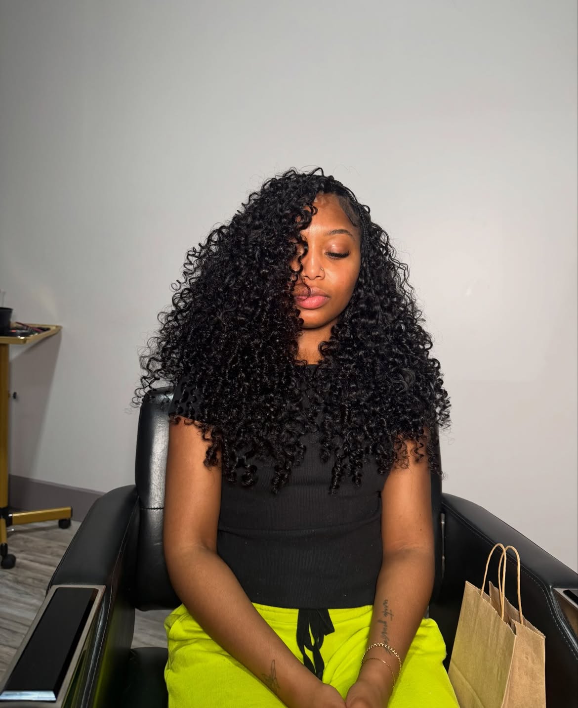 Voluminous Jet Black Curly Knotless Braids