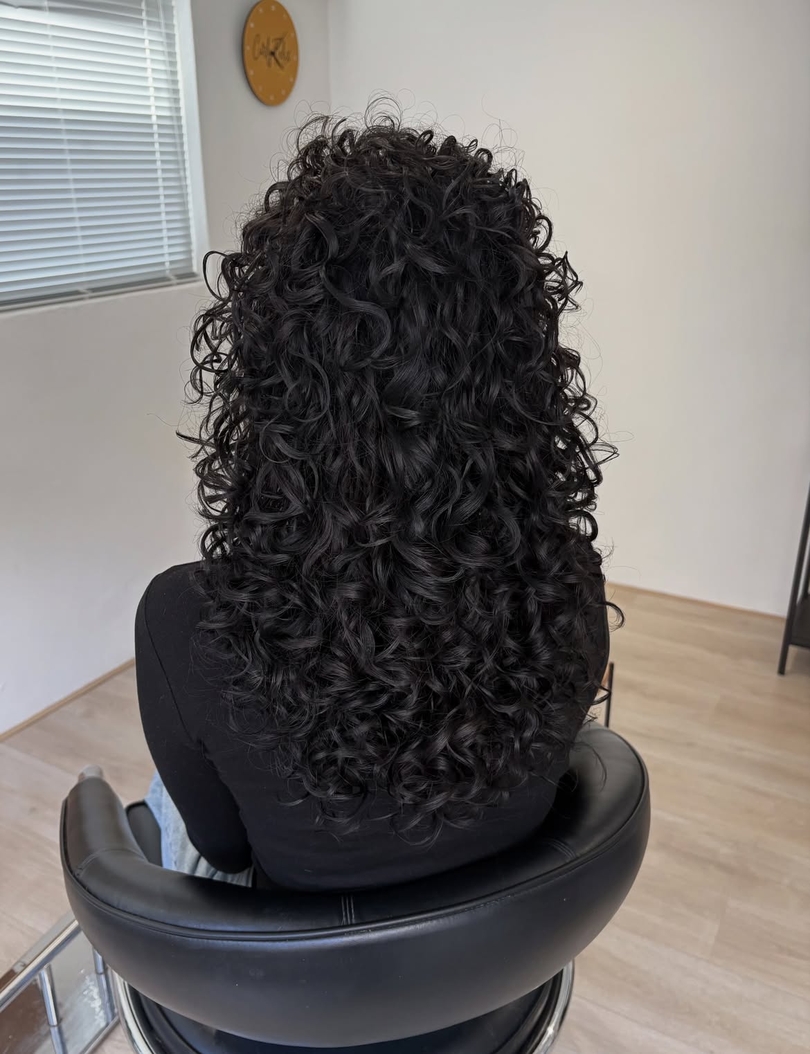 Voluminous Layered Cut For Deep Brunette Curls