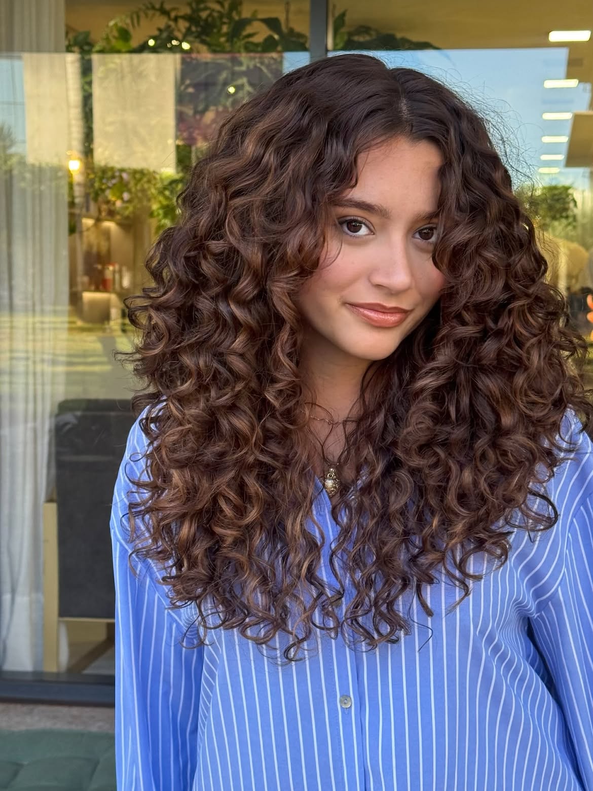 Voluminous Layered Cut For Rich Espresso Curly Hair