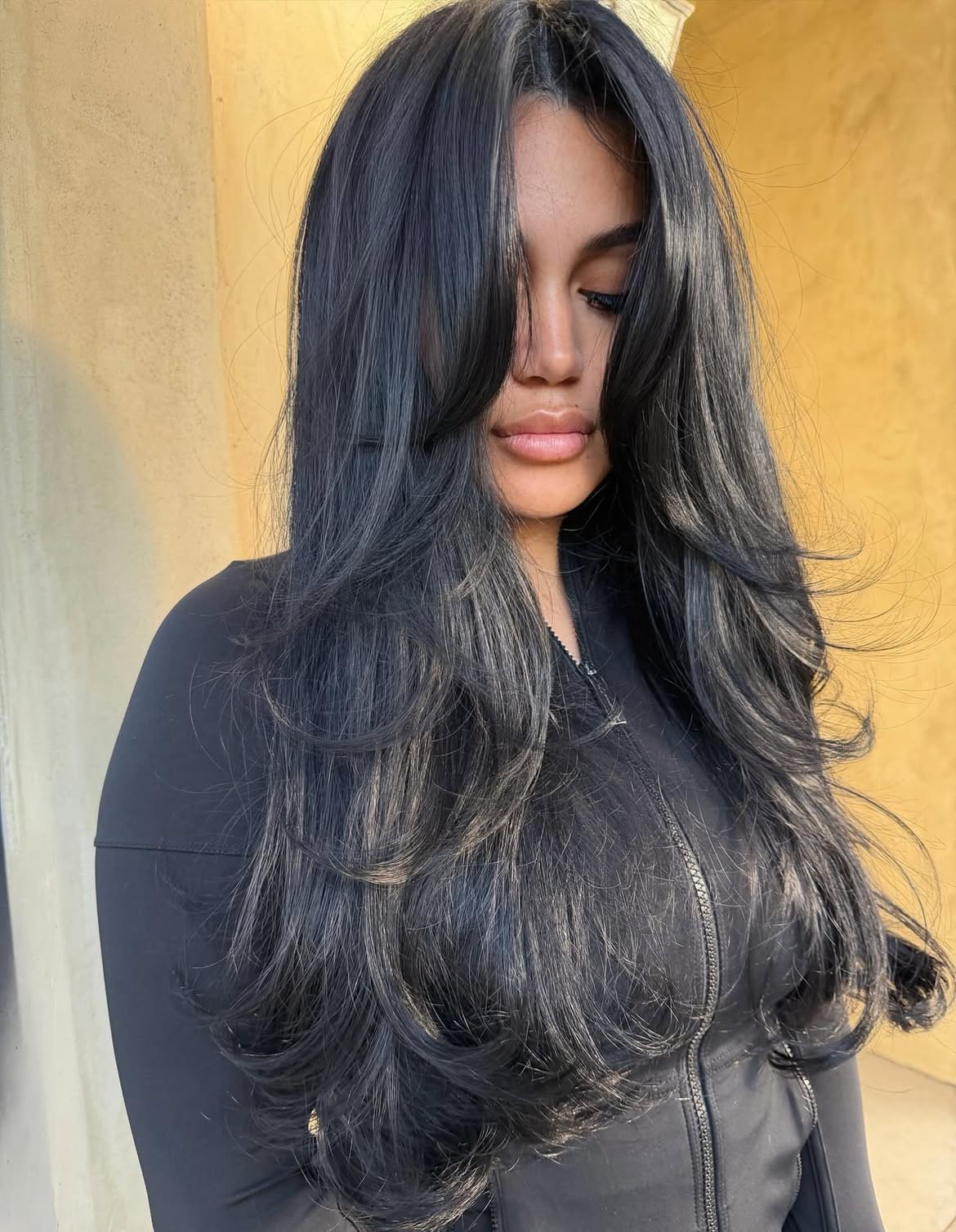 Voluminous Layered Cut With Dramatic Curtain Bangs