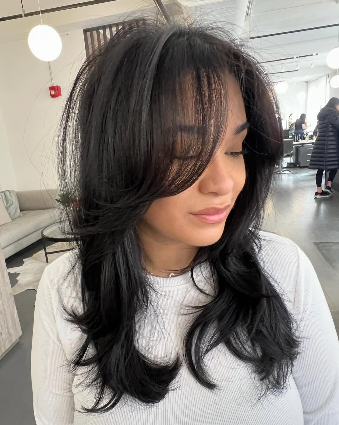 Voluminous Layered Cut With Side Swept Bangs