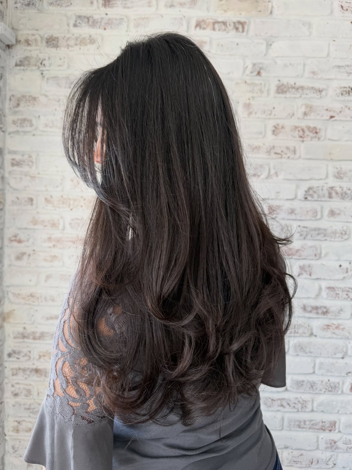 Voluminous Long Layers With Face Framing Curtain Bangs