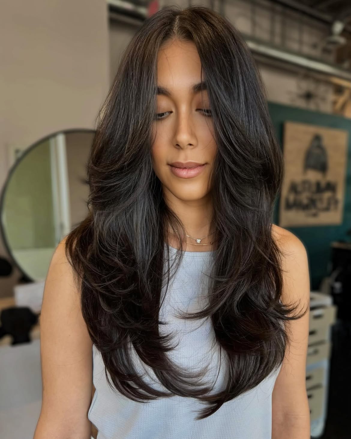 Voluminous Long Layers With Face Framing Curtain Bangs