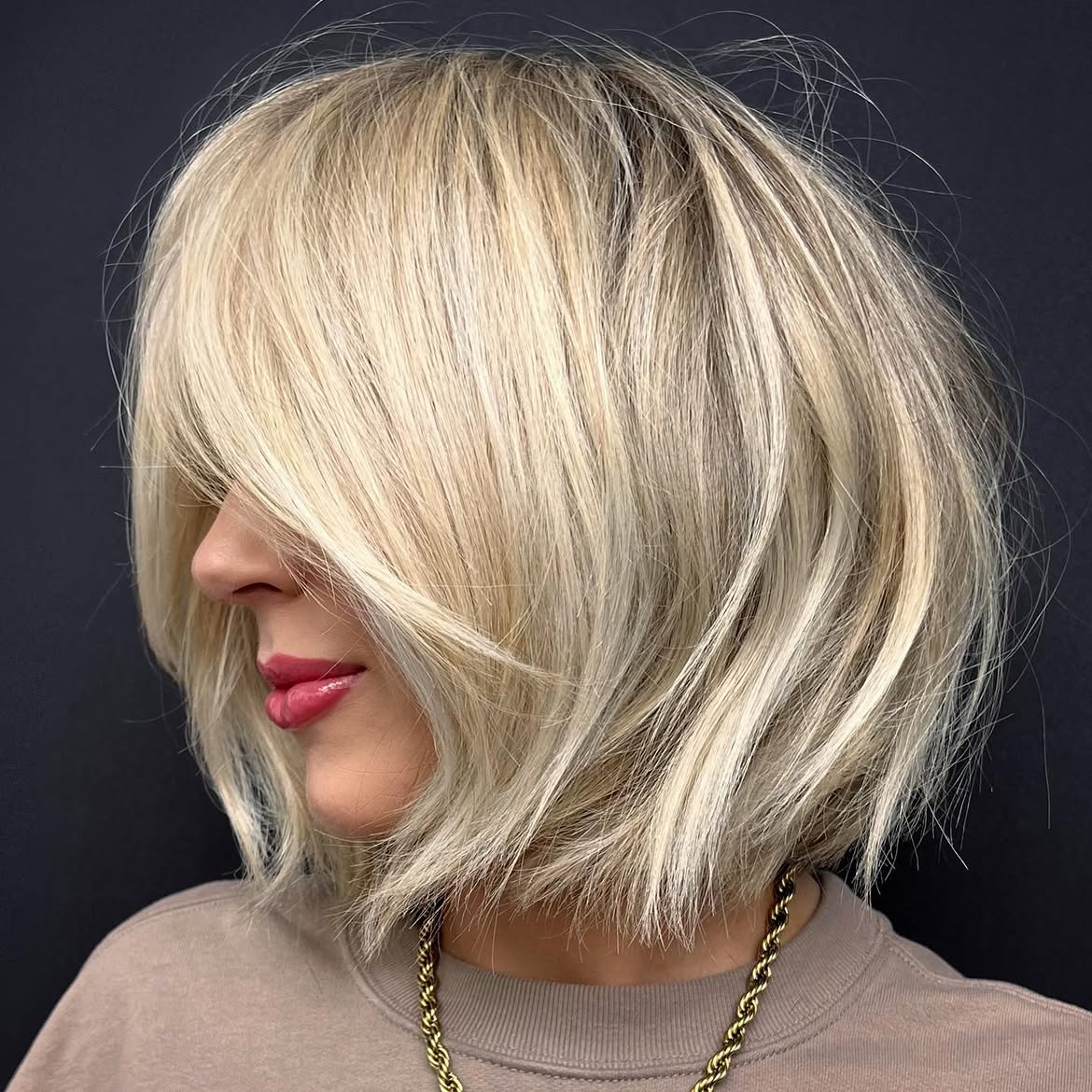 Blonde Bob With Face Framing Layers and Curtain Bangs