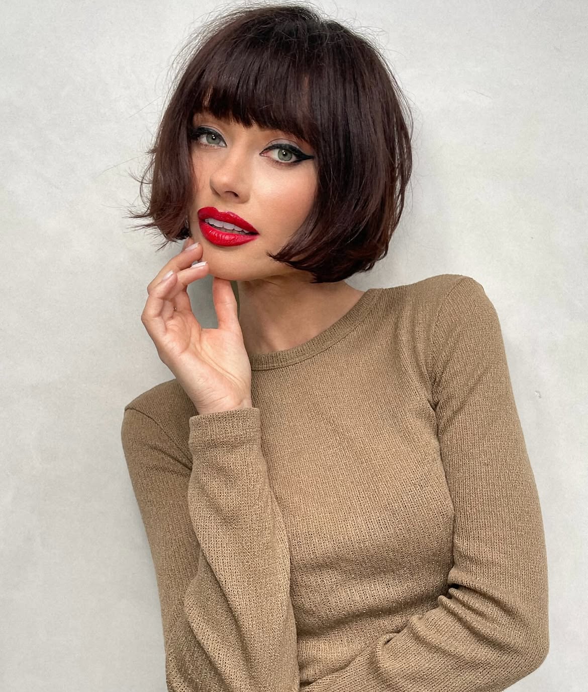 Chic French Bob with Blunt Bangs and Subtle Waves