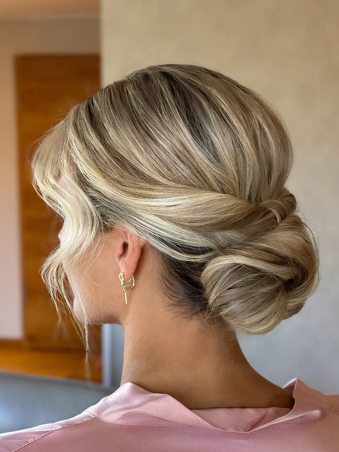 Elegant Low Chignon With Face Framing Tendrils