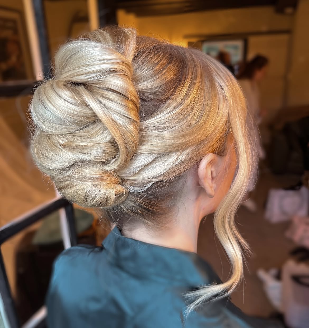 Elegant Twisted Low Chignon With Face Framing Tendrils