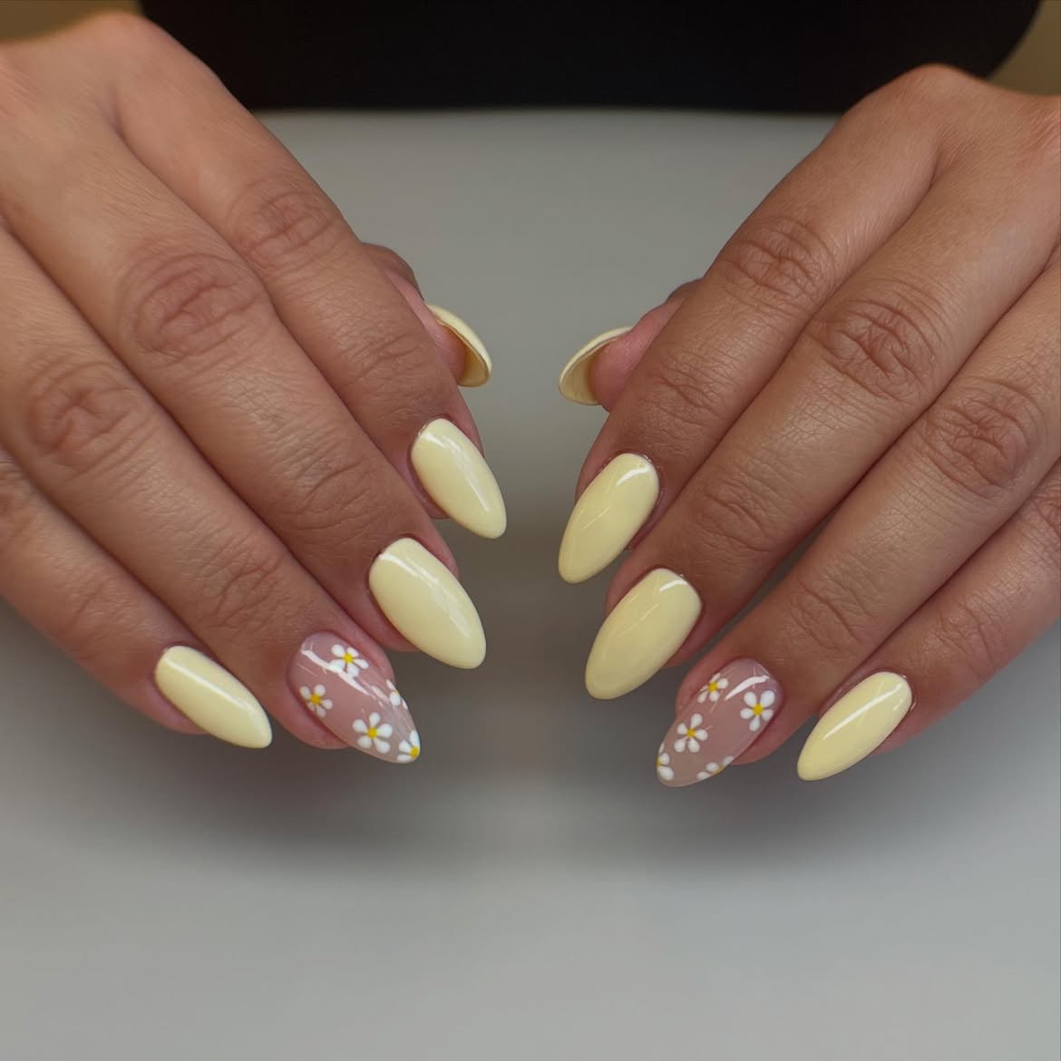 Pastel Yellow Almond Nails with Daisy Accents