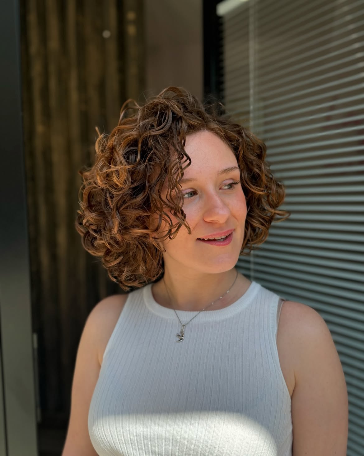 Textured Curly Bob With Warm Auburn Highlights