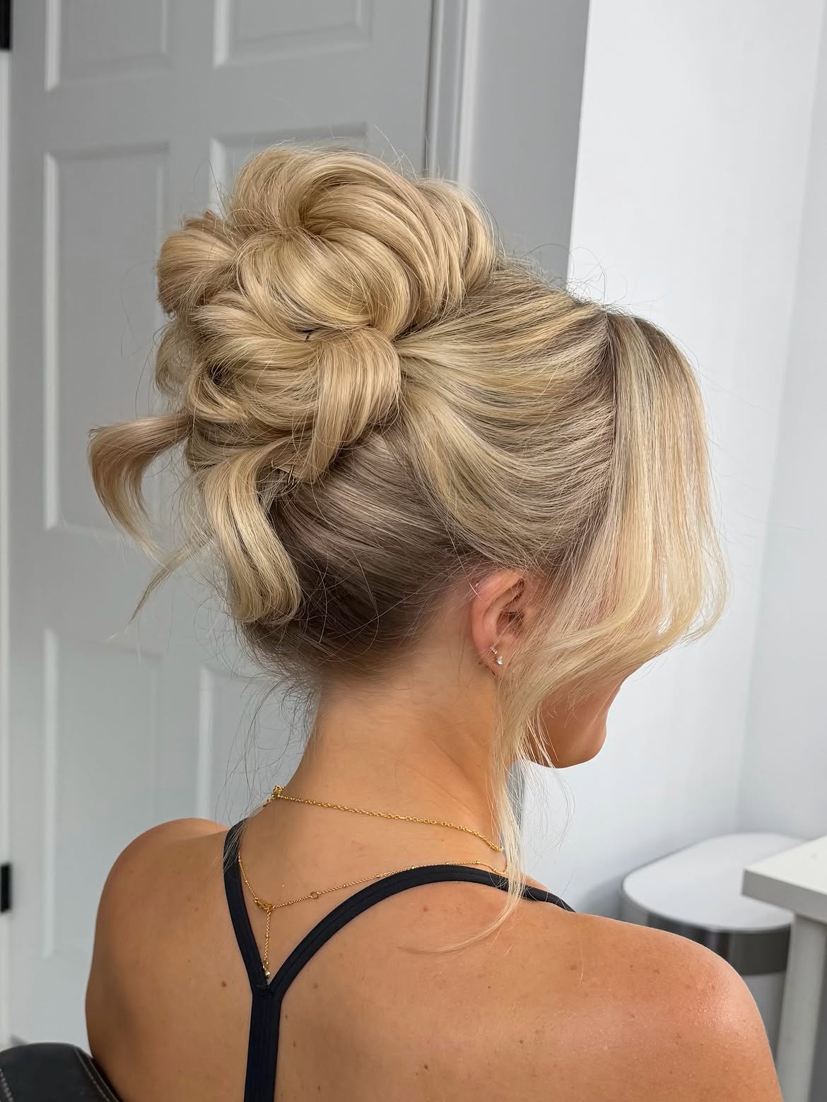 Textured Messy Blonde Updo With Soft Face Framing