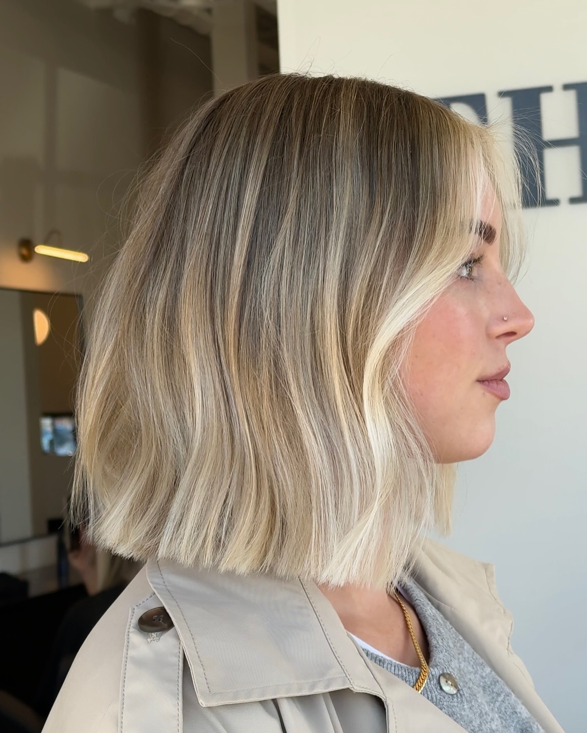 Tousled Platinum Blonde Bob With Face-Framing Highlights