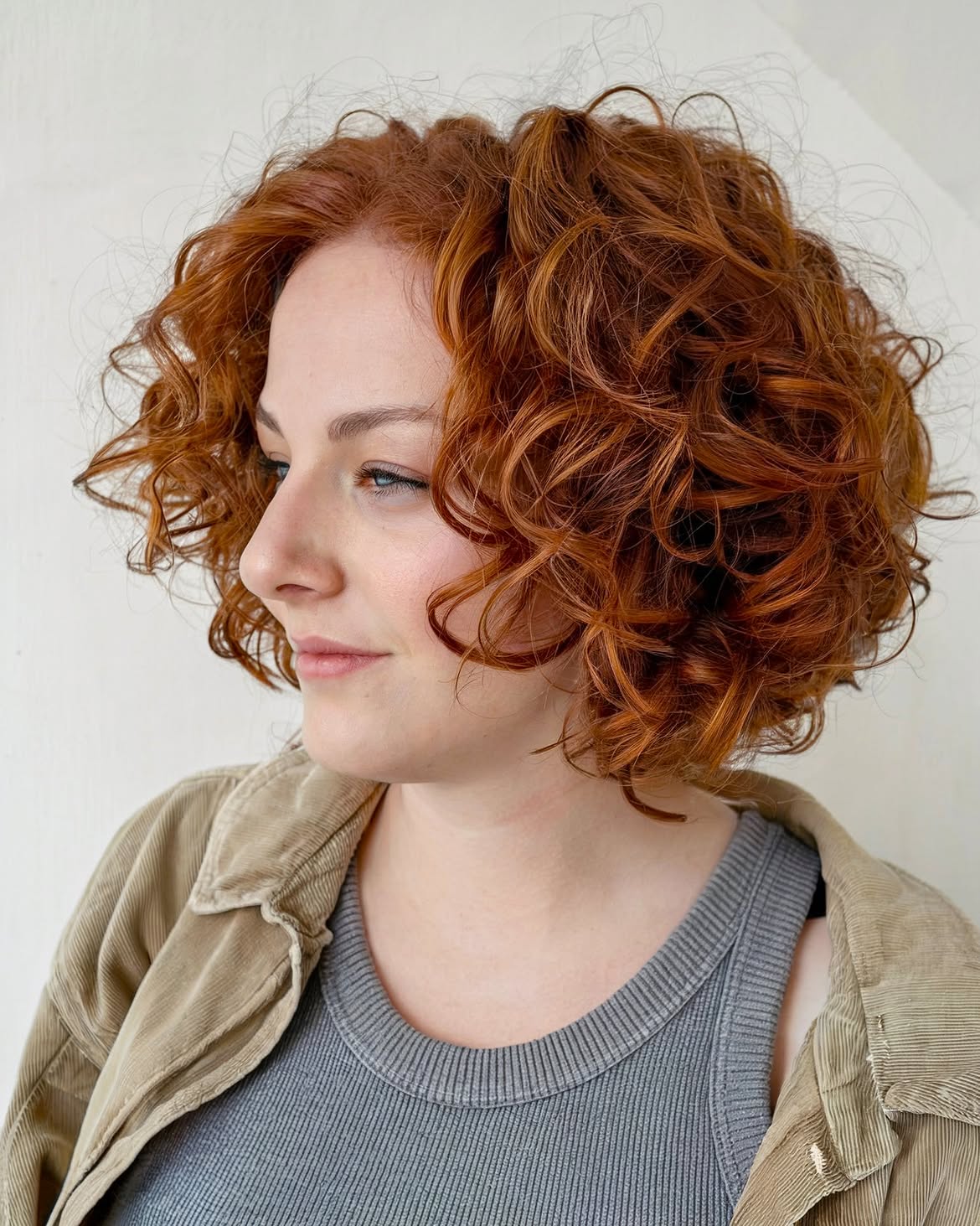 Voluminous Copper Curly Bob With Soft Layers