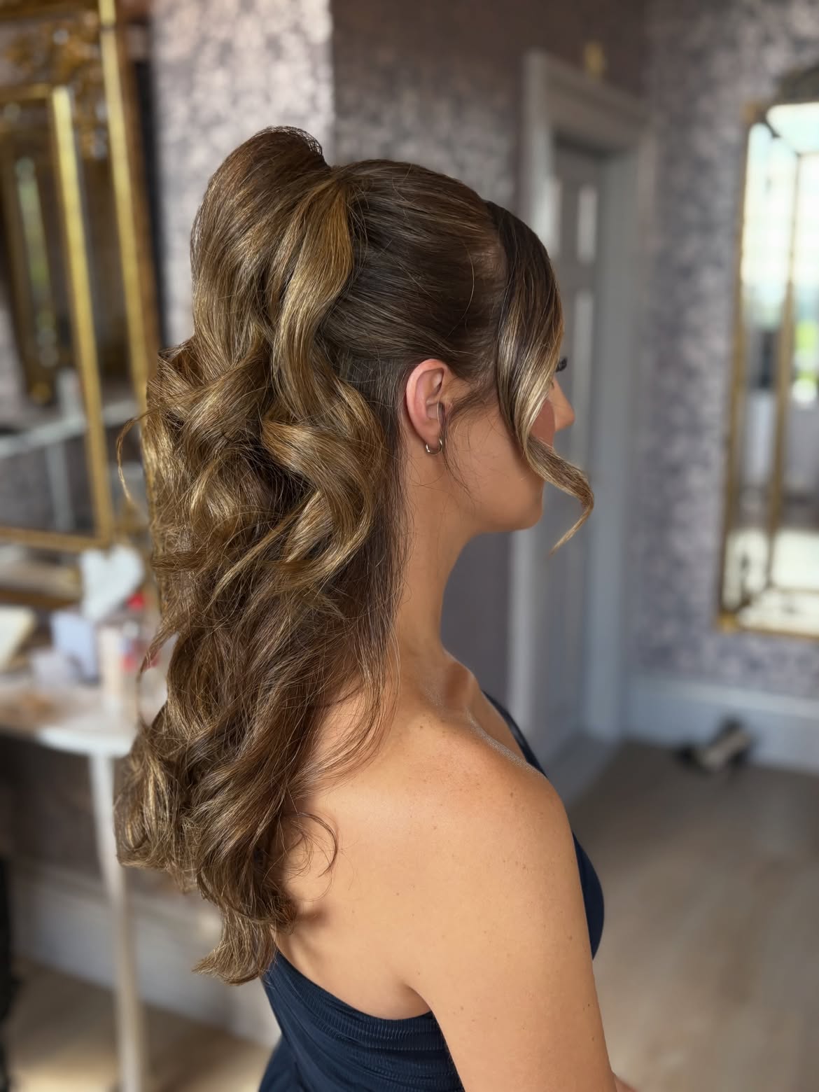 Voluminous High Ponytail With Soft Face Framing Waves