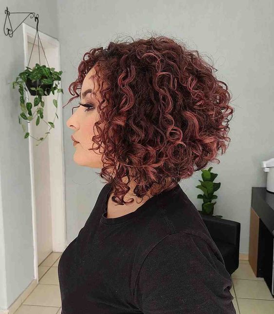 Voluminous Stacked Curly Bob With Auburn Highlights