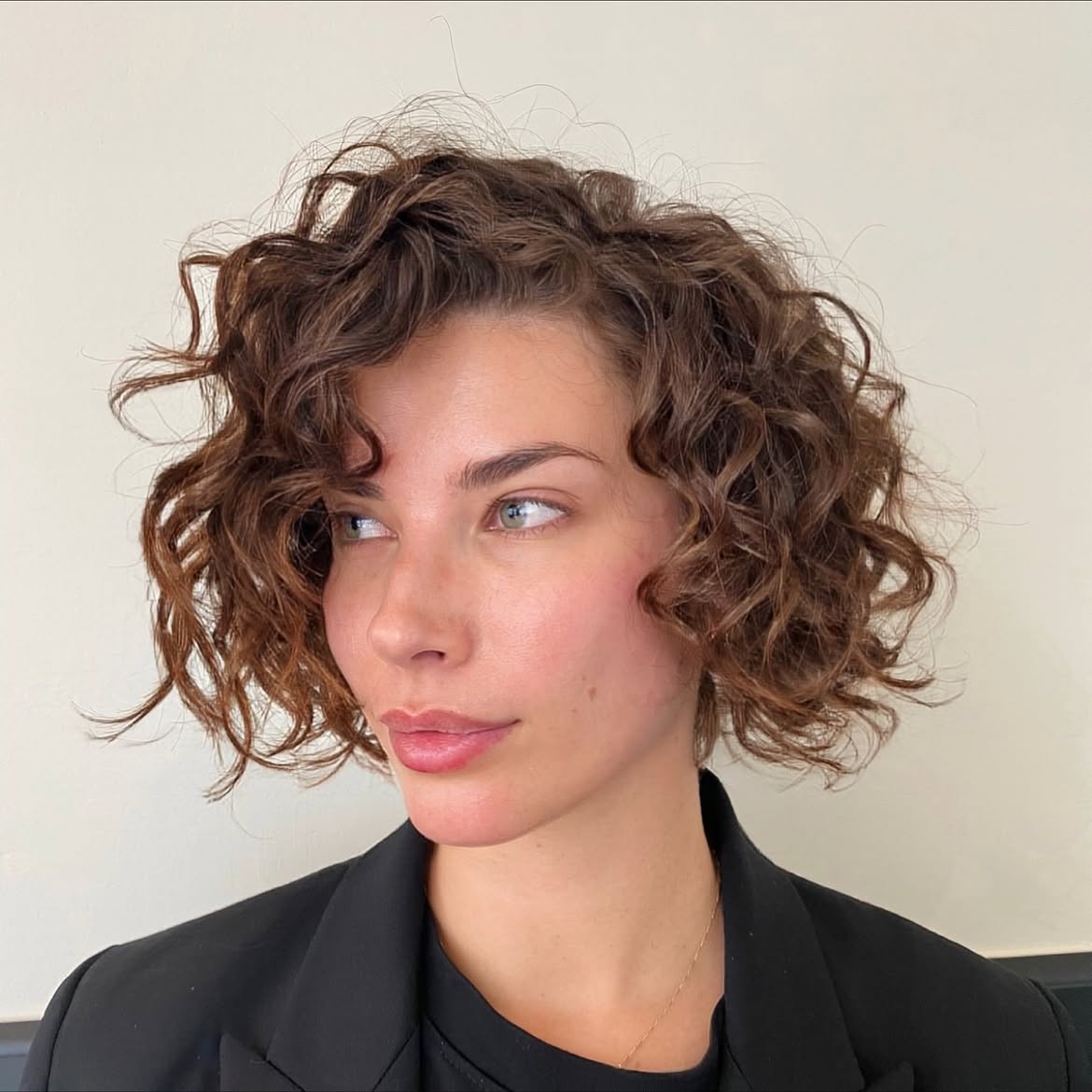 Voluminous Textured Curly Bob With Deep Side Part