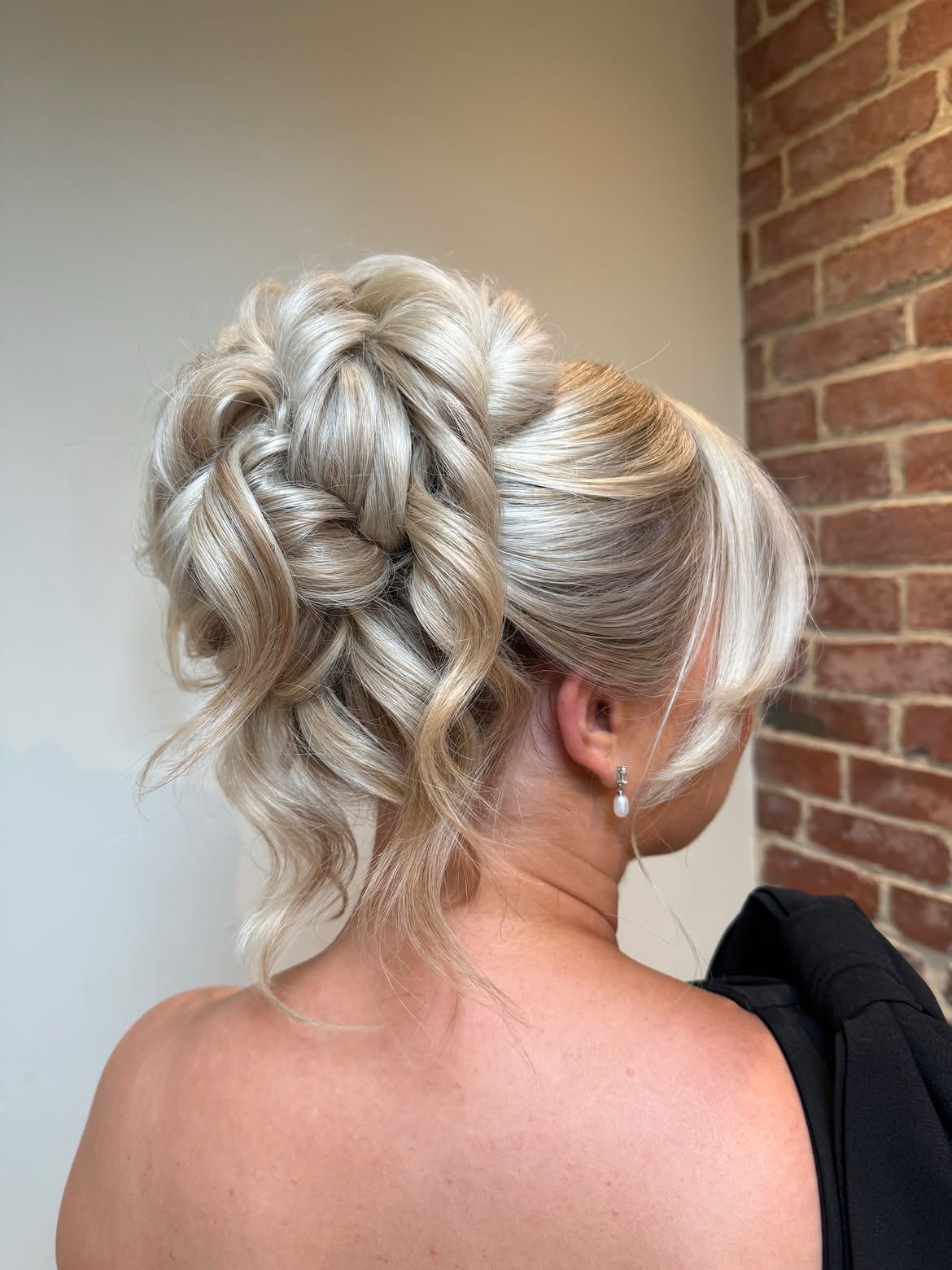 Voluminous Textured Updo With Soft Face Framing