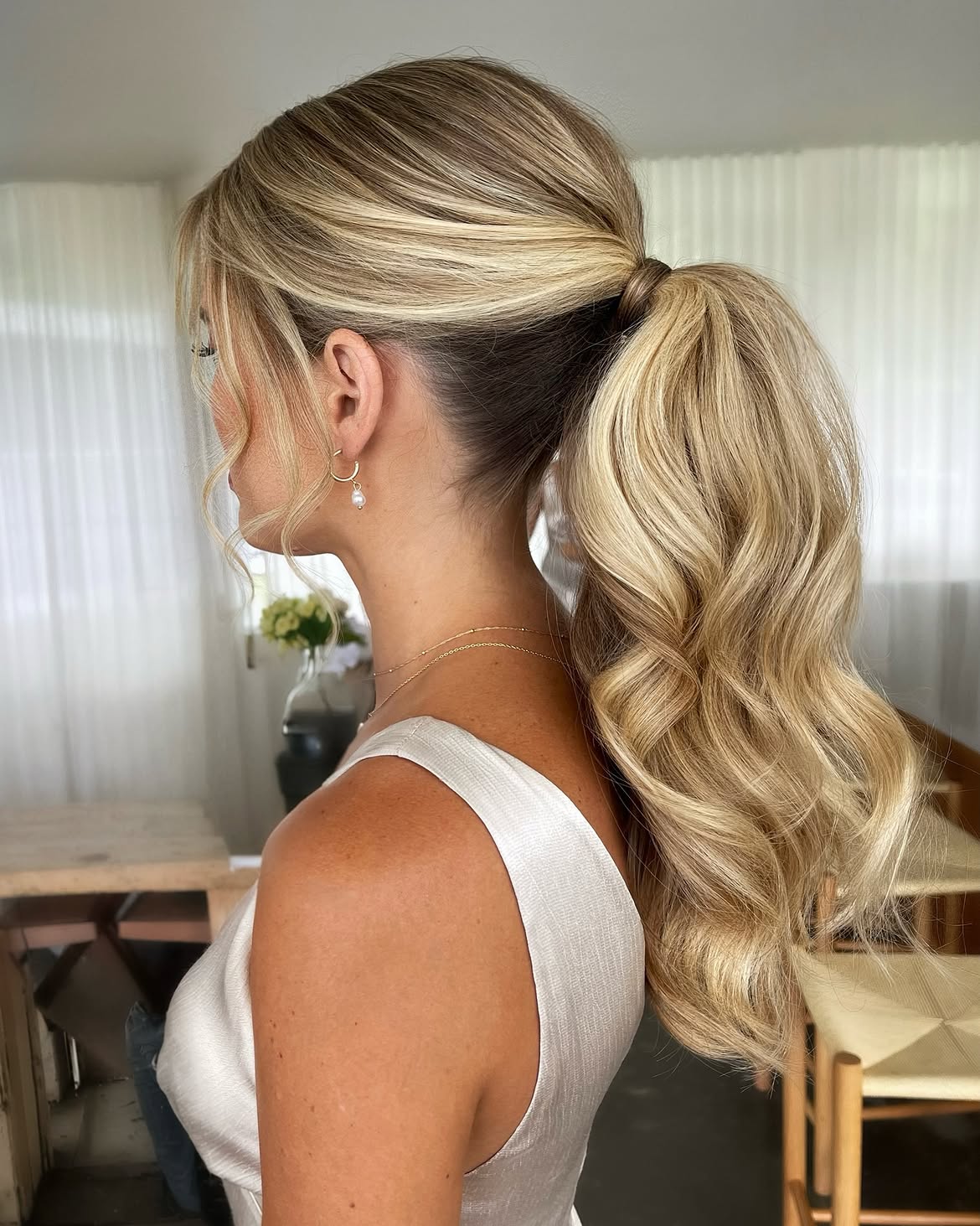 Voluminous Wavy Ponytail With Face Framing Strands